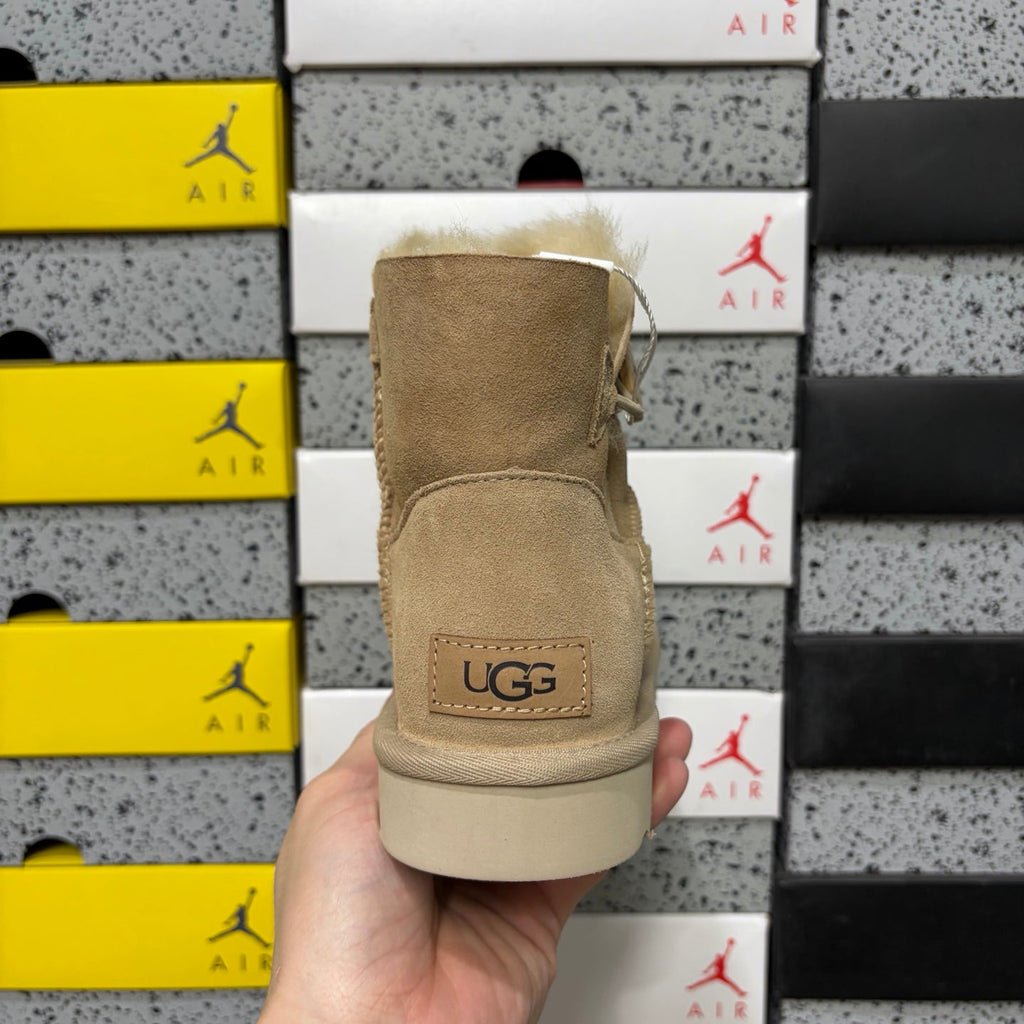 UGG Kallen Lace Mini Boot – Suede Ankle Boot with Shearling Cuff & Signature Button Closure in Sand